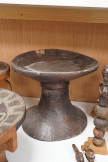 Two African tribal busts, two carved spoons and three carved Kamba Kenyan stools (11). Largest stool 28cm high. Condition - mostly good, some staining to seat of largest stool